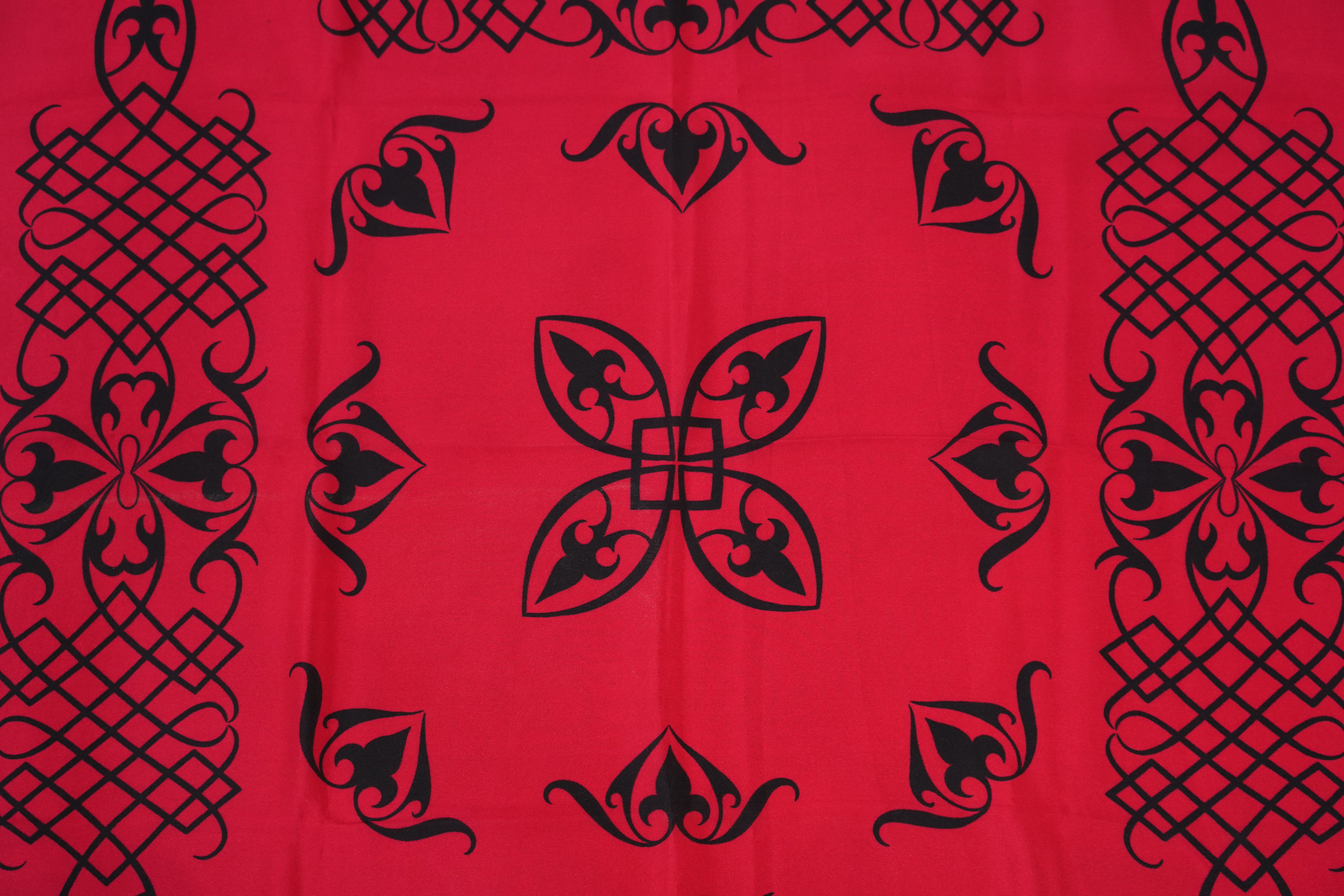 A Yves Saint Laurent silk scarf, a Jean Cocteau zodiac design silk scarf and a Rodier silk scarf.